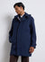Hooded parka with covered closure