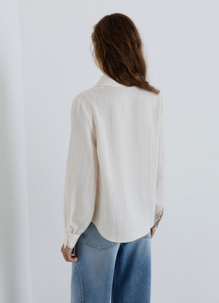 Blusa con rever sciallato a righe