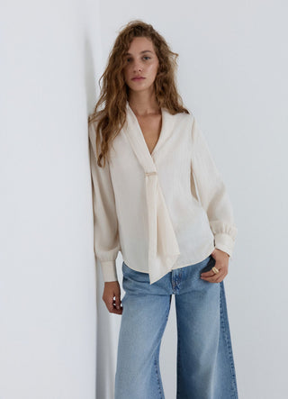 Blusa con rever sciallato a righe