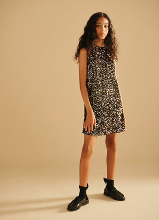 Vestito con paillettes e fiocco sul retro