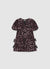Vestito con paillettes e fiocchi laterali
