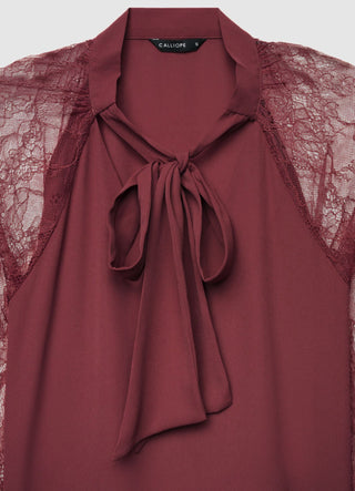 Blusa con fiocco e maniche in pizzo