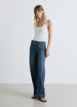 Jeans wide leg con patta asimmetrica
