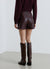 Gonna-pantalone mini effetto pelle con zip laterale