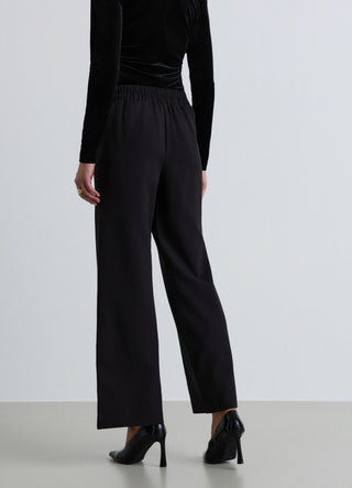 Pantaloni harem con drappeggio e spilla