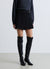 Gonna-pantalone corta con pieghe e fibbia