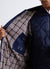 Hooded parka with covered closure