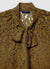 Camicia in pizzo con fiocco al collo