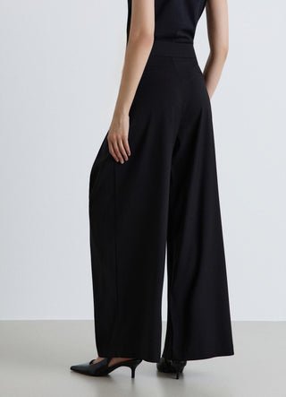 Pantaloni palazzo con pieghe e tasche alla francese