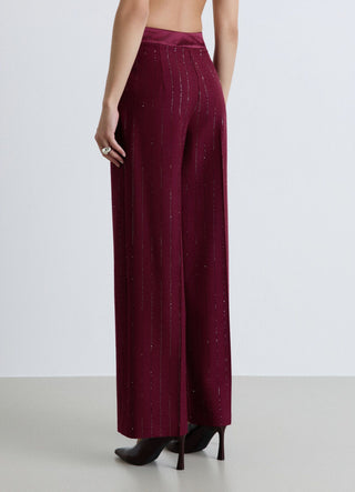 Pantaloni palazzo gessati con paillettes