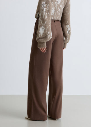 Pantaloni palazzo con patta asimmetrica