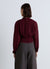 Pleated blouse with high neck
