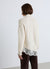 Pull doux à col en V avec dentelle à la base