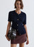 Cardigan a trecce con bottoni gioiello