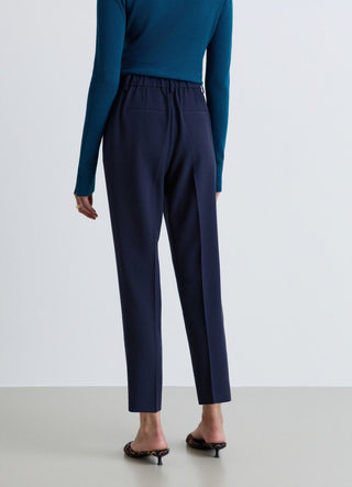 Pantaloni con pinces e vita elasticizzata