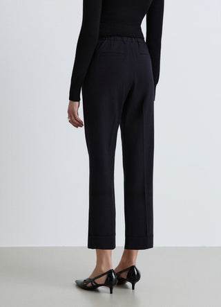 Pantaloni con elastico in vita e risvolto