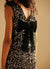 Vestito con paillettes e fiocco sul retro