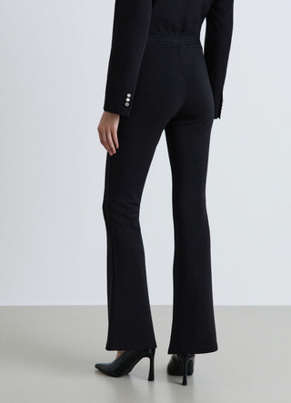 Flared long leggings with gathered elasticated waistband