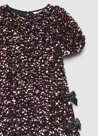 Vestito con paillettes e fiocchi laterali