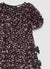 Vestito con paillettes e fiocchi laterali