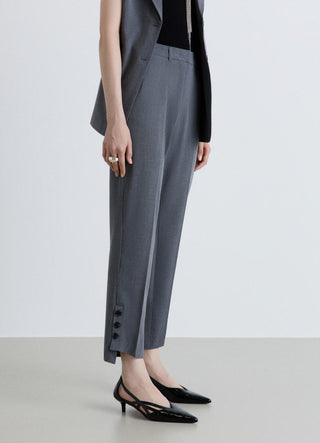 Pantaloni sigaretta con bottoni al fondo