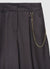 Pantaloni ampi con catena
