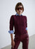 Sweater with cable knit and ruffles