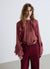 Bluse mit Volants und bezogenen Knöpfen