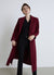 Cappotto lungo con chiusura a un bottone