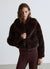 Giacca crop effetto peluche con collo rever