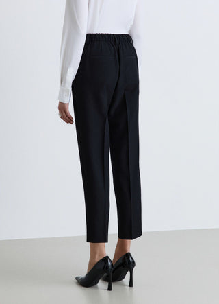 Pantaloni con pinces e vita elasticizzata