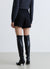 Gonna-pantalone corta con pieghe e fibbia