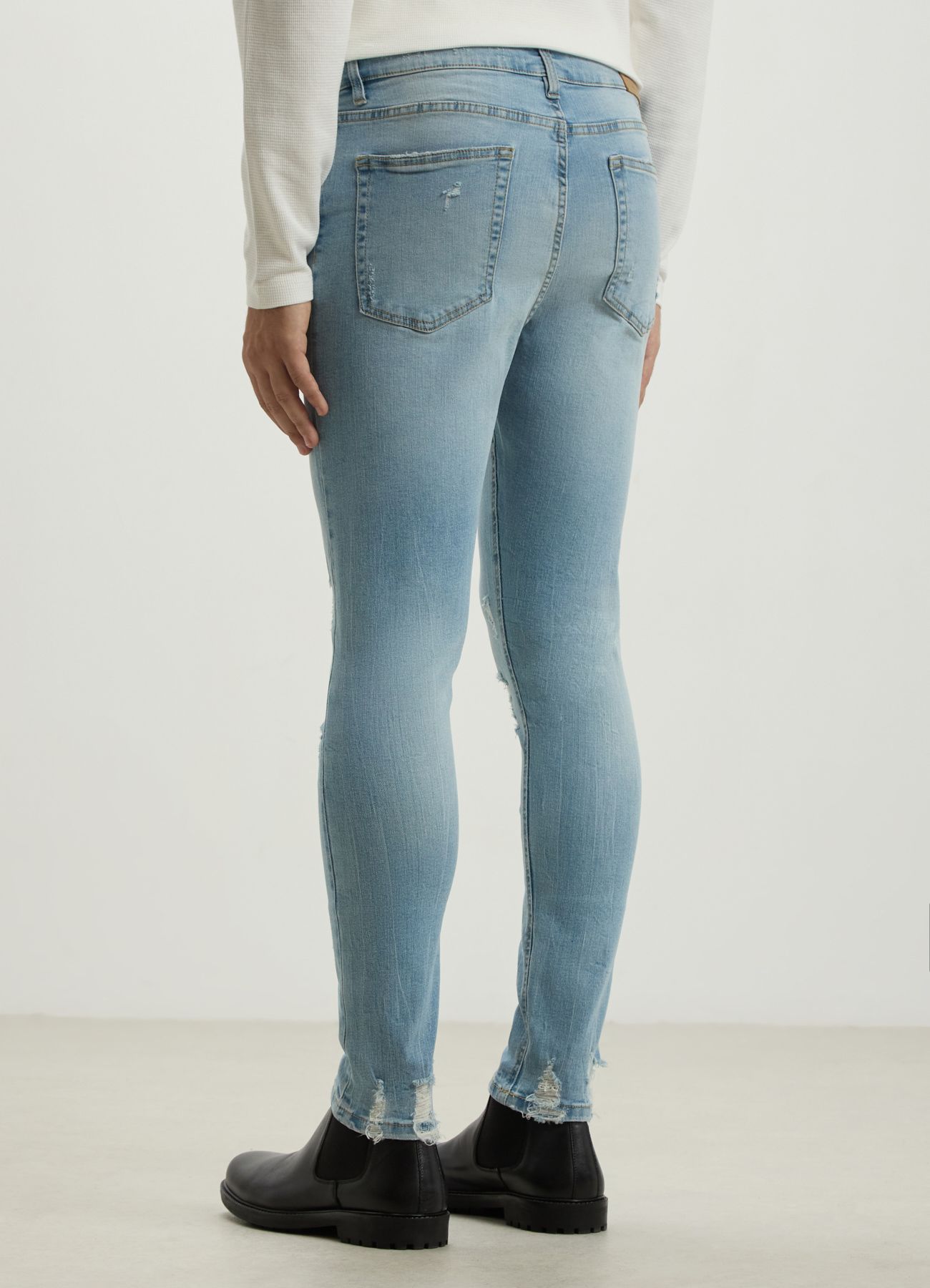 Jeans skinny con rotture blu denim slavato Calliope